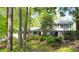 Charming two-story home with a well-manicured lawn and mature trees creating a serene, wooded setting at 2940 Blue Sky Pl, Marietta, GA 30068