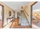 Inviting foyer with hardwood floors, a staircase, and views into other rooms showcasing the home's elegance at 2940 Blue Sky Pl, Marietta, GA 30068