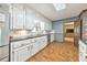 Kitchen with white cabinets, stainless-steel refrigerator, and tile backsplash at 2940 Blue Sky Pl, Marietta, GA 30068