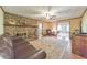 Warm and inviting living room with a stone fireplace, hardwood floors, and comfortable furnishings at 2940 Blue Sky Pl, Marietta, GA 30068