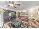 The living room includes a large leather couch, a large entertainment center, and hard wood floors at 2940 Blue Sky Pl, Marietta, GA 30068