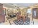 A large living room contains a large dining table, a sitting area with leather couches and a large window at 2940 Blue Sky Pl, Marietta, GA 30068