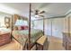 Tranquil main bedroom featuring a four-poster bed and ample closet space at 2940 Blue Sky Pl, Marietta, GA 30068