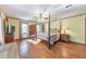 Large main bedroom with hardwood floors, windows, and traditional furnishings at 2940 Blue Sky Pl, Marietta, GA 30068