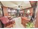 Cozy wood-paneled office with fireplace, built-in bookshelves, and desk at 2940 Blue Sky Pl, Marietta, GA 30068