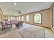 Bright sun room with large windows, comfortable seating, and natural light, perfect for enjoying the outdoors indoors at 2940 Blue Sky Pl, Marietta, GA 30068