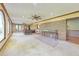 Bright sunroom with brick accent wall, ceiling fans, and large windows at 2940 Blue Sky Pl, Marietta, GA 30068
