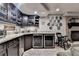 Basement bar area with custom cabinets, stone countertops, and dual beverage coolers at 5023 Buckline Xing, Dunwoody, GA 30338