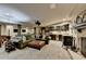 Entertaining basement area featuring a fireplace, bar, and ample seating for guests at 5023 Buckline Xing, Dunwoody, GA 30338
