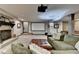 Cozy basement with a brick fireplace, projector screen, and comfortable seating area at 5023 Buckline Xing, Dunwoody, GA 30338