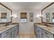Bright bathroom features double vanity, granite countertops, and matching framed mirrors at 5023 Buckline Xing, Dunwoody, GA 30338