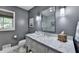 Stylish bathroom with marble countertop, gray walls, and a glass-enclosed shower at 5023 Buckline Xing, Dunwoody, GA 30338