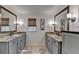 Bright bathroom features double vanity, granite countertops, and matching framed mirrors at 5023 Buckline Xing, Dunwoody, GA 30338