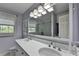 Stylish bathroom features double vanity, modern lighting, and a separate shower at 5023 Buckline Xing, Dunwoody, GA 30338