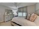 Comfortable bedroom features a neutral color palette, plush bed, and dresser at 5023 Buckline Xing, Dunwoody, GA 30338