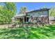 Charming home exterior with a well-manicured backyard, patio and lovely landscaping at 5023 Buckline Xing, Dunwoody, GA 30338