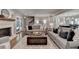 Cozy living room featuring a fireplace, large ottoman, and stylish decor at 5023 Buckline Xing, Dunwoody, GA 30338