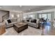 Inviting living room with hardwood floors, comfortable sofas, and open floor plan to the dining area at 5023 Buckline Xing, Dunwoody, GA 30338
