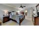 Spacious main bedroom with a king bed, wood furniture, and plenty of natural light at 5023 Buckline Xing, Dunwoody, GA 30338