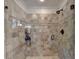 Modern shower features glass doors, tile surround, and rainfall shower head at 5023 Buckline Xing, Dunwoody, GA 30338