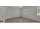 Neutral bedroom with plush carpeting, white trim, and large window at 4366 Karls Gate Dr, Marietta, GA 30068