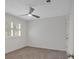 Bright, neutrally decorated bedroom with a ceiling fan and plush carpeting at 4366 Karls Gate Dr, Marietta, GA 30068