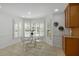 Bright breakfast nook featuring tile floor, windows with blinds, and a round glass table at 4366 Karls Gate Dr, Marietta, GA 30068