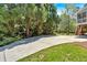 Long driveway leading to a home with mature trees and well-maintained landscaping at 4366 Karls Gate Dr, Marietta, GA 30068
