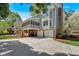 Charming home featuring a screened porch, two-car garage, large driveway, and mature trees at 4366 Karls Gate Dr, Marietta, GA 30068