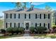 Charming two-story home with a manicured front yard and classic architectural details at 4366 Karls Gate Dr, Marietta, GA 30068
