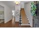 Welcoming foyer with hardwood floors, staircase, and view into other rooms at 4366 Karls Gate Dr, Marietta, GA 30068