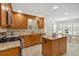 Bright kitchen features granite counters, tile floors, stainless appliances, and a center island at 4366 Karls Gate Dr, Marietta, GA 30068