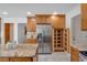 Lovely kitchen showcasing stainless steel fridge, wooden cabinetry, granite counters, and a pantry at 4366 Karls Gate Dr, Marietta, GA 30068
