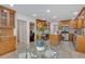Open kitchen and breakfast nook showcasing stainless appliances, wooden cabinetry, and tile flooring at 4366 Karls Gate Dr, Marietta, GA 30068