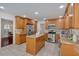 Spacious kitchen with wooden cabinets, stainless steel appliances, granite counters, and center island at 4366 Karls Gate Dr, Marietta, GA 30068