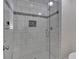 Contemporary tiled shower with glass enclosure and modern fixtures at 4366 Karls Gate Dr, Marietta, GA 30068