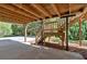 View of the home's support structure, deck stairs and concrete slab for parking or outdoor enjoyment at 4366 Karls Gate Dr, Marietta, GA 30068