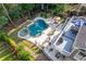 Aerial view showcasing the pool, spa, patio and deck in the landscaped backyard at 5724 Kendrick Ln, Cumming, GA 30041