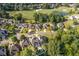 Stunning aerial view of a home with a pool in a golf community at 5724 Kendrick Ln, Cumming, GA 30041