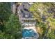 Aerial view of the home, showing the large, landscaped backyard, pool and patio at 5724 Kendrick Ln, Cumming, GA 30041