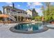 Backyard oasis featuring a large in-ground pool with a hot tub, waterfall and sundeck at 5724 Kendrick Ln, Cumming, GA 30041