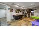 Finished basement featuring a billiard table, fun decor and game machines on a durable tiled floor at 5724 Kendrick Ln, Cumming, GA 30041