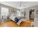 This bedroom features natural light, wood floors, ceiling fan, neutral colors, and closet at 5724 Kendrick Ln, Cumming, GA 30041