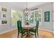 Charming breakfast nook with hardwood floors, bright windows, and stylish decor provides a cozy eating area at 5724 Kendrick Ln, Cumming, GA 30041