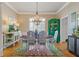 Stylish dining room featuring a chandelier, elegant furnishings, and natural light, perfect for gatherings at 5724 Kendrick Ln, Cumming, GA 30041