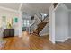 Elegant foyer featuring hardwood floors, a staircase, and open layout, offering a grand entrance at 5724 Kendrick Ln, Cumming, GA 30041