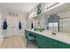 Spacious main bathroom boasts a double vanity with vibrant green cabinetry and stylish fixtures, adding a touch of luxury at 5724 Kendrick Ln, Cumming, GA 30041