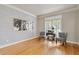 Bright and airy office space with hardwood floors, designer wallpaper, and natural light, ideal for productivity at 5724 Kendrick Ln, Cumming, GA 30041