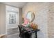 This office space offers a brick accent wall, a desk area, and lots of natural light at 5724 Kendrick Ln, Cumming, GA 30041