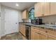 This wet bar has wooden cabinets, stone counter top, microwave, mini fridge, and bar sink at 5724 Kendrick Ln, Cumming, GA 30041